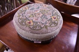 A Victorian beadwork footstool, diameter approx. 30cm