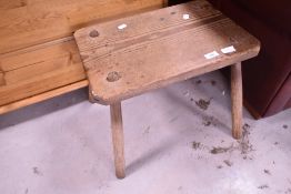 A rustic pine four legged stool, approx 46 x 30cm