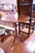 A 19th Century mahogany pedestal occasional table having circular tilt top, turned column and triple