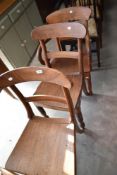 Three (two plus one) Victorian solid seat chairs having rail backs