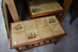 Two graduated teak and tile top coffee tables on castors with slatted undershelves