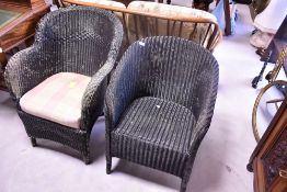 Two vintage Lloyd Loom tub chairs, overpainted black