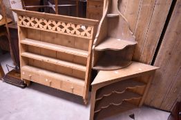 Three assorted pine shelves, comprising plate rack (width 94cm) and two corner shelves