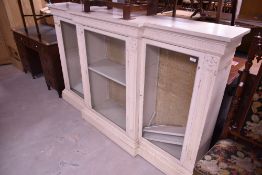 A painted breakfront bookcase/display cabinet in a neoclassical style, width approx. 190cm, height