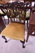 A late 19th or early 20th Century pagoda style fretwork dining chair having dralon upholstery