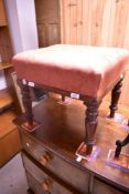 A Victorian mahogany framed dressing table stool having later upholstery