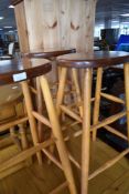 A set of three traditional beech kitchen bar stools
