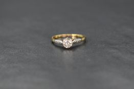 An 18ct gold diamond solitaire, the brilliant round cut diamond measuring approximately 0.25ct, in a