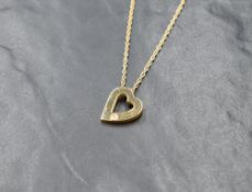 A 9ct gold open heart pendant with small inset diamond on a 9ct gold rope chain, approx 15' & 4.9g