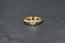 An 18ct gold diamond solitaire ring, the round brilliant cut diamond measuring approximately 0.37ct,