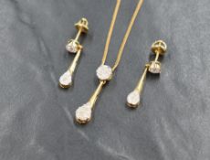 An 18ct gold and diamond necklace and earring set, the necklace having a circular seven diamond