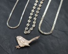 Three silver chains of various designs and a white metal brooch stamped silver in the form of a