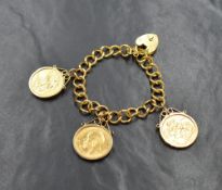 A 22ct gold curb link bracelet, having three sovereign coins in removable mounts, along with a heart