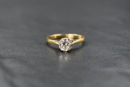 An 18ct gold diamond solitaire, the round brilliant cut diamond measuring approximately 0.75ct in