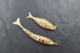 Two yellow metal articulated fish pendants, one bearing 9ct gold hallmarks, the other bearing damage