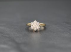 A 9ct gold diamond cluster ring, the floral motif cluster having a total of approximately 0.50ct,