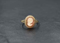A 9ct gold cameo ring, the bezel set cameo depicting a maiden in profile with a twisted rope mount