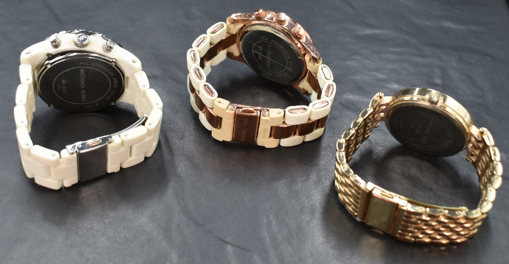 Three Michael Kors wristwatches, comprising one having a white dial, Arabic and square numerals, - Image 3 of 3