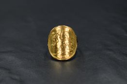 A 1967 gold sovereign ring having curved sovereign with attached yellow metal loop, no marks but