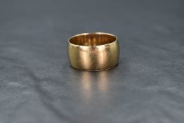 A gent's 9ct gold wedding band of broad form, size V & approx 9g