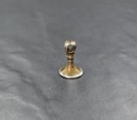 A white metal seal fob, depicting a shield coat of arms, 2cm, 6.3g