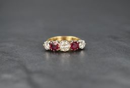 A five stone diamond and ruby ring having three diamonds, total approx 1ct interspersed by two