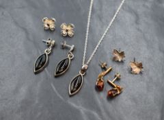 A small assortment silver and white metal jewellery, comprising a marquise onyx pendant and drop