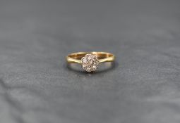 An 18ct gold diamond daisy cluster ring, the central diamond chip with a seven diamond chip