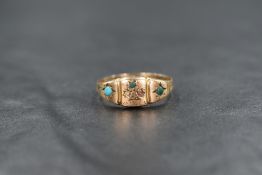 A 9ct gold turquoise gypsy style ring, the three central turquoise cabochons in a flower motif,