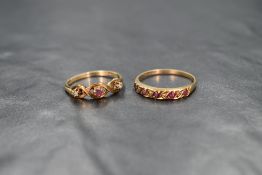 A 9ct gold ruby and diamond trilogy ring, the central round cut ruby flanked by two diamond chips in