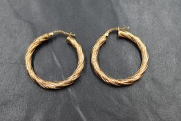 A pair of 9ct gold hoop earrings of moulded twist form, approx 3g
