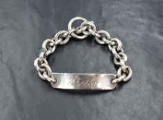 A 1970's silver ID bracelet of stylised heavy form bearing name: Sheila to name plaque and having