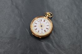 A small continental yellow gold top wound pocket watch stamped 14K having a Roman numeral dial