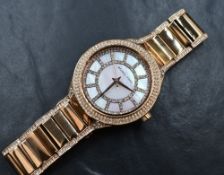 A lady's Michael Kors quartz fashion wrist watch having a diamante set dial to mother of pearl