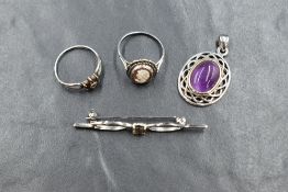 A small selection of silver jewellery, comprising a garnet cluster ring, a cameo ring, a bar