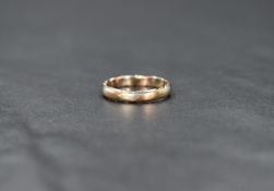 A 9ct gold three tone ring, having twisted bands of yellow, white and rose gold, ring size G-H, 1.