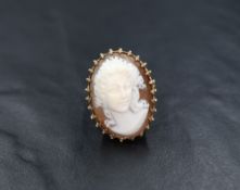 A 9ct gold large shell cameo ring, the prominent cameo possibly depicting Hera in an ornate claw