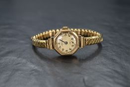 A lady's vintage 9ct gold wrist watch by Avia having Arabic numeral dial and subsidiary seconds to