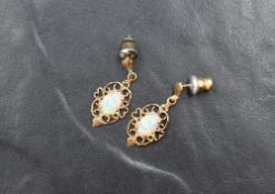 A pair of 9ct gold stud earring having faux opal set drops in open mounts, approx 1.4g