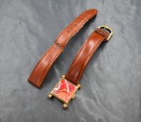 A 1940 Bulova 'senator' wristwatch, the square red dial having Arabic numerals and subsidiary