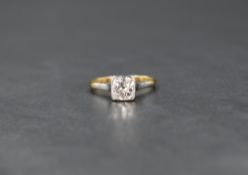 A diamond solitaire ring, having an old cut cushion style stone, approx 0.85ct in a rub over