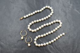 A single row of cultured pearls, having a white to pink lustre with a 9ct hook clasp,