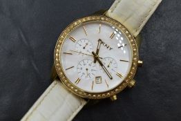 A lady's DKNY quartz fashion wrist watch having a baton numeral face with three central dials and