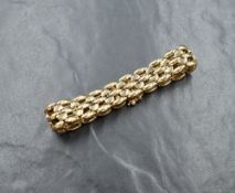 A 9ct gold fancy link gate bracelet, with safety clasp, 27.1g. Unable to open clasp
