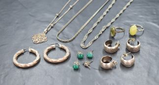 A small selection of silver and white metal jewellery including stud and hoop earrings, pendant,