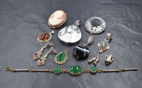 An assortment of silver and white metal jewellery, including a large silver mother-of-pearl pendant,