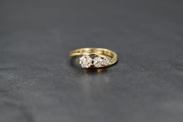 An 18ct diamond trilogy ring having three old cut stones in a cascade style, approx 0.75ct total