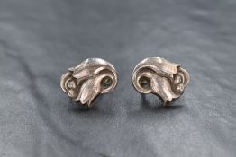 A pair of vintage Danish silver screw back earrings by Georg Jensen having moulded hair bell design,