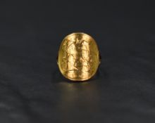 An 1899 Victorian half sovereign ring having a curved coin to yellow metal fixed split shoulders and