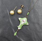 A silver and enamel Art Nouveau style pendant having central rose decoration and green enamelled